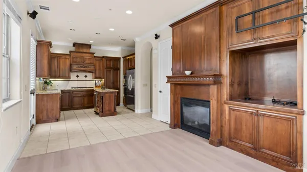 a kitchen with stainless steel appliances granite countertop a stove top oven and sink