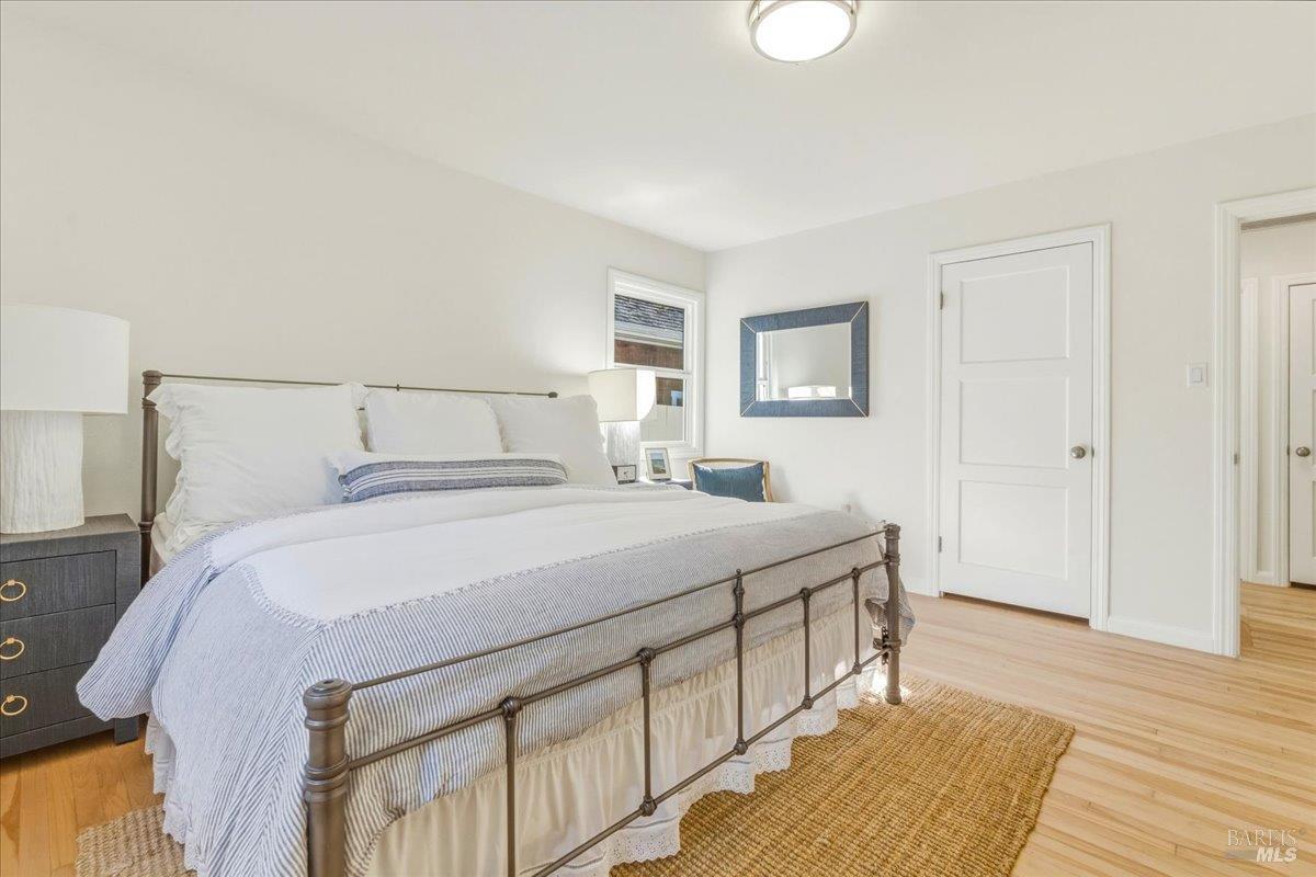 250 Butterfield Road San Anselmo, CA 94960 - Photo 12 of 28 a bedroom with a bed and a night stand