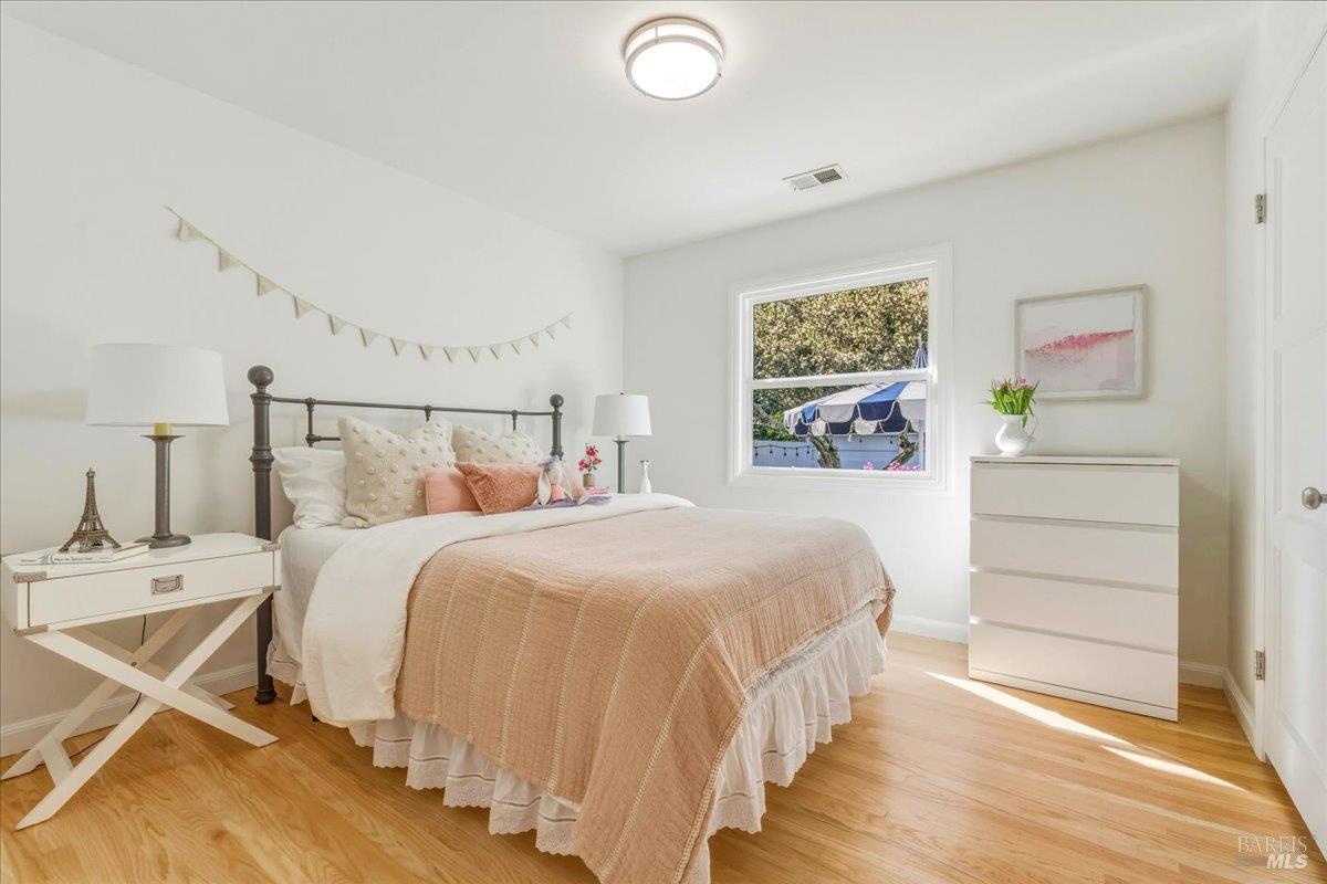 250 Butterfield Road San Anselmo, CA 94960 - Photo 13 of 28 a bedroom with a bed and a window