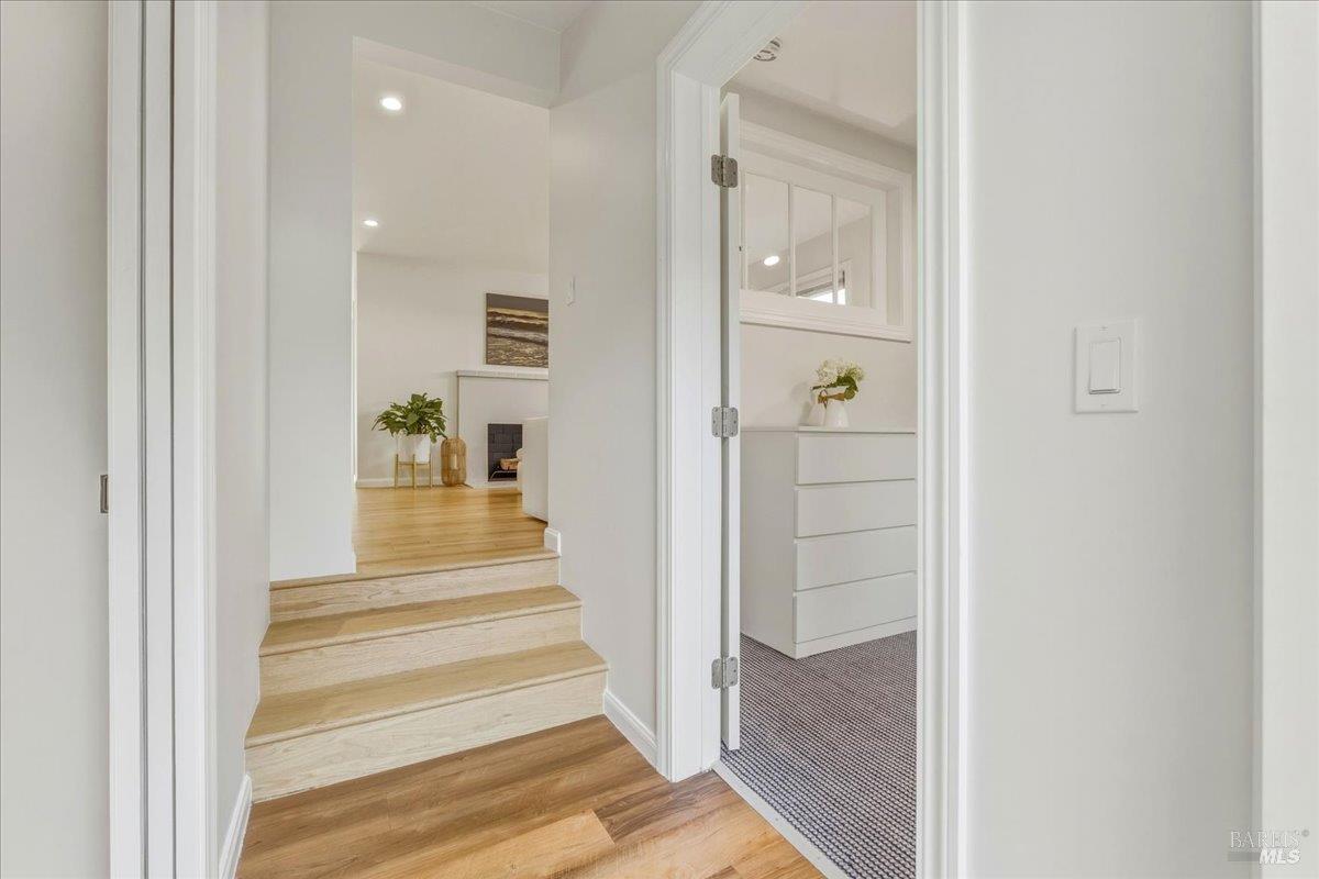 250 Butterfield Road San Anselmo, CA 94960 - Photo 17 of 28 a view of a hallway with wooden floor and entryway
