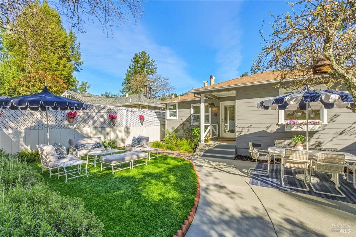250 Butterfield Road San Anselmo, CA 94960 - Photo 20 of 28 a view of a chairs and table in backyard
