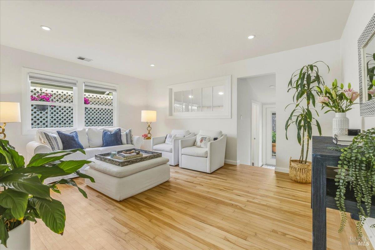 250 Butterfield Road San Anselmo, CA 94960 - Photo 6 of 28 a living room with furniture and a wooden floor