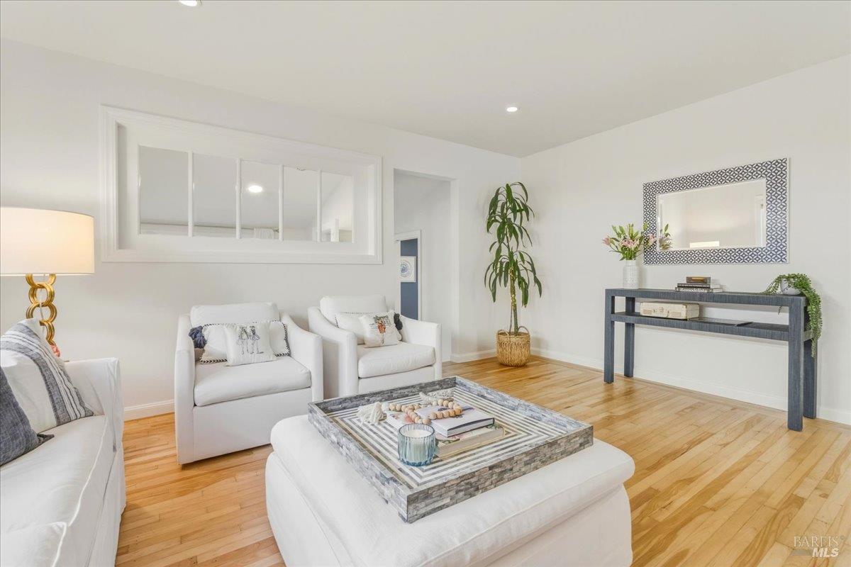 250 Butterfield Road San Anselmo, CA 94960 - Photo 8 of 28 a living room with furniture and wooden floor
