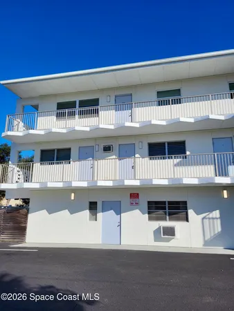 a view of pool with brick walls