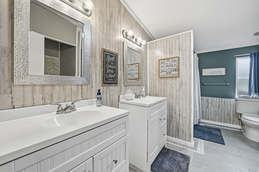 194 Burgess Road Ellijay, GA 30540 - Photo 15 of 32 a bathroom with a sink and a mirror