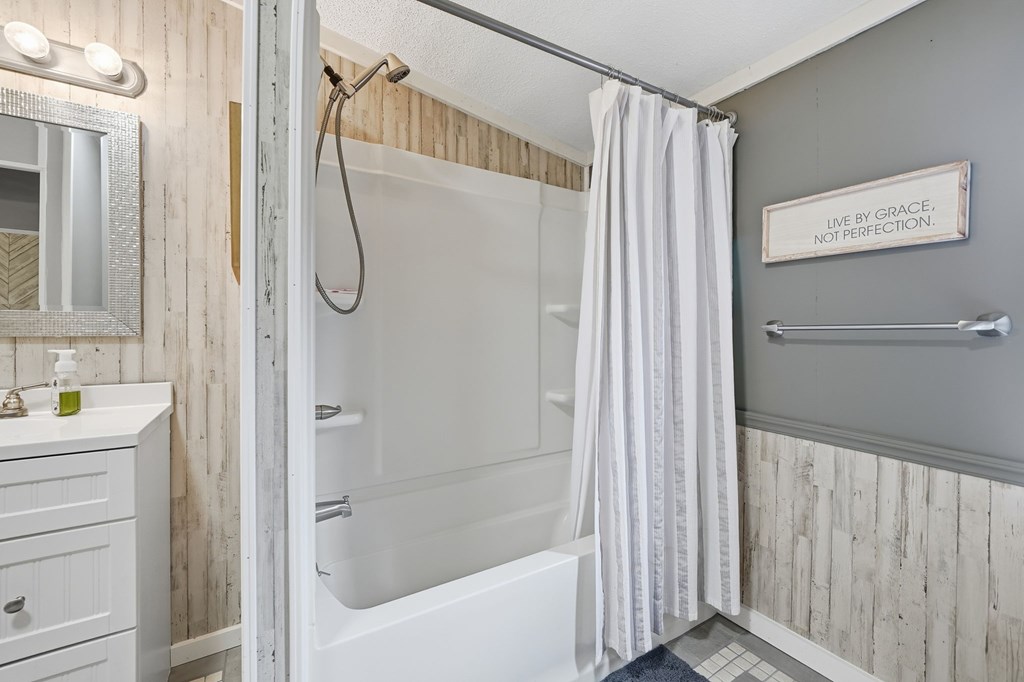 194 Burgess Road Ellijay, GA 30540 - Photo 18 of 32 a bathroom with a shower and a sink