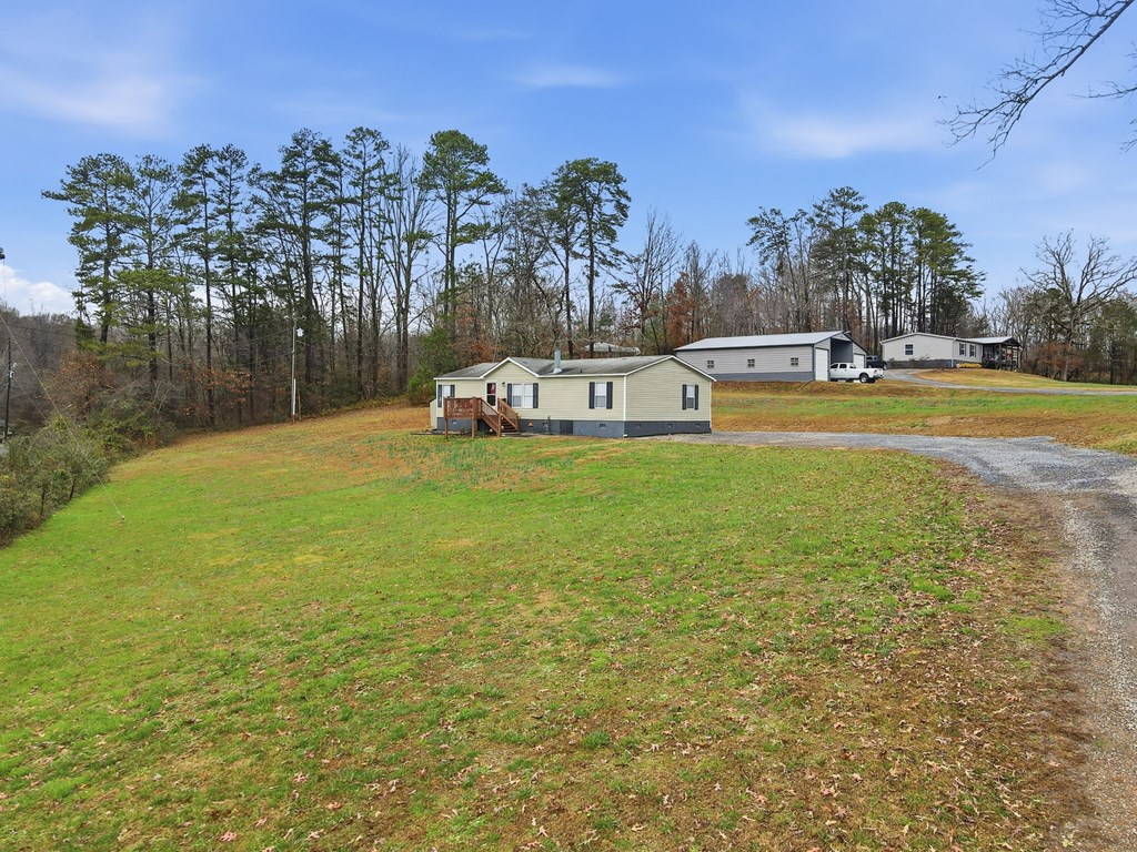 194 Burgess Road Ellijay, GA 30540 - Photo 2 of 32 a view of yard with swimming pool and trees