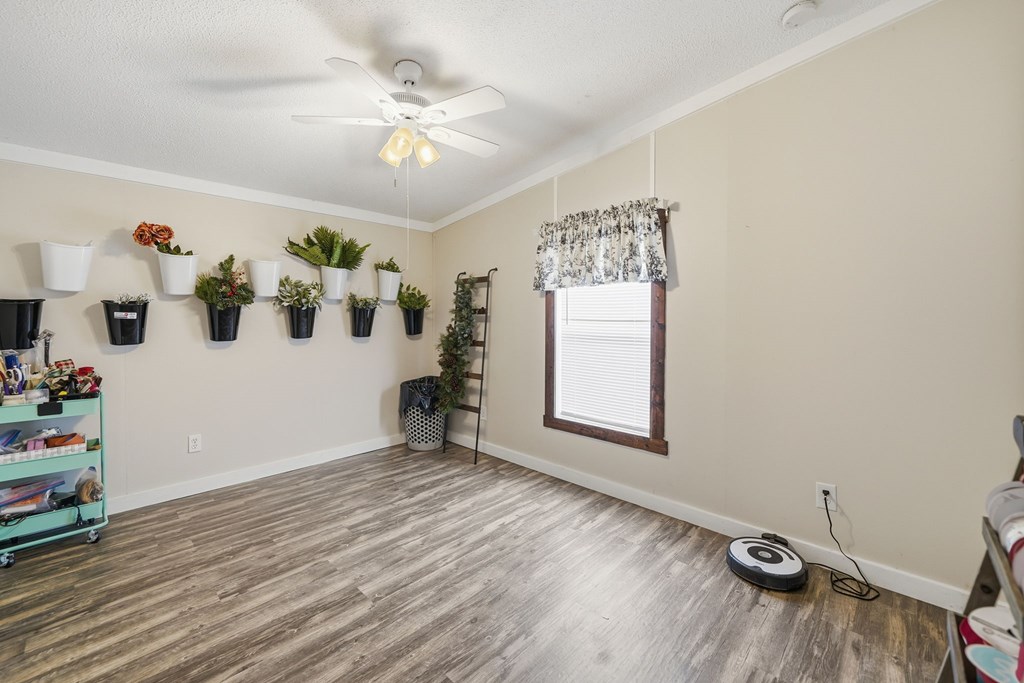 194 Burgess Road Ellijay, GA 30540 - Photo 21 of 32 wooden floor in an empty room with a window