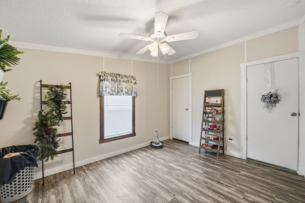 194 Burgess Road Ellijay, GA 30540 - Photo 22 of 32 wooden floor in an empty room with a window