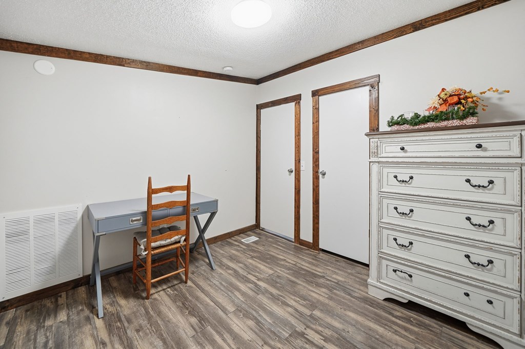 194 Burgess Road Ellijay, GA 30540 - Photo 23 of 32 a view of a bedroom with furniture and wooden floor