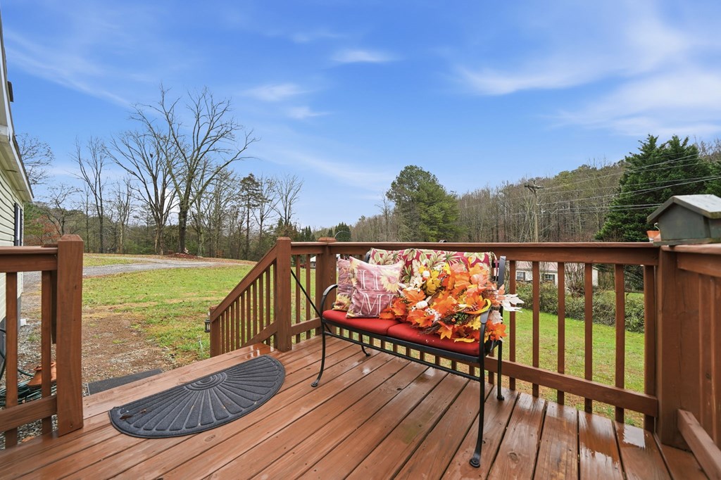 194 Burgess Road Ellijay, GA 30540 - Photo 24 of 32 a view of balcony with wooden floor and fence