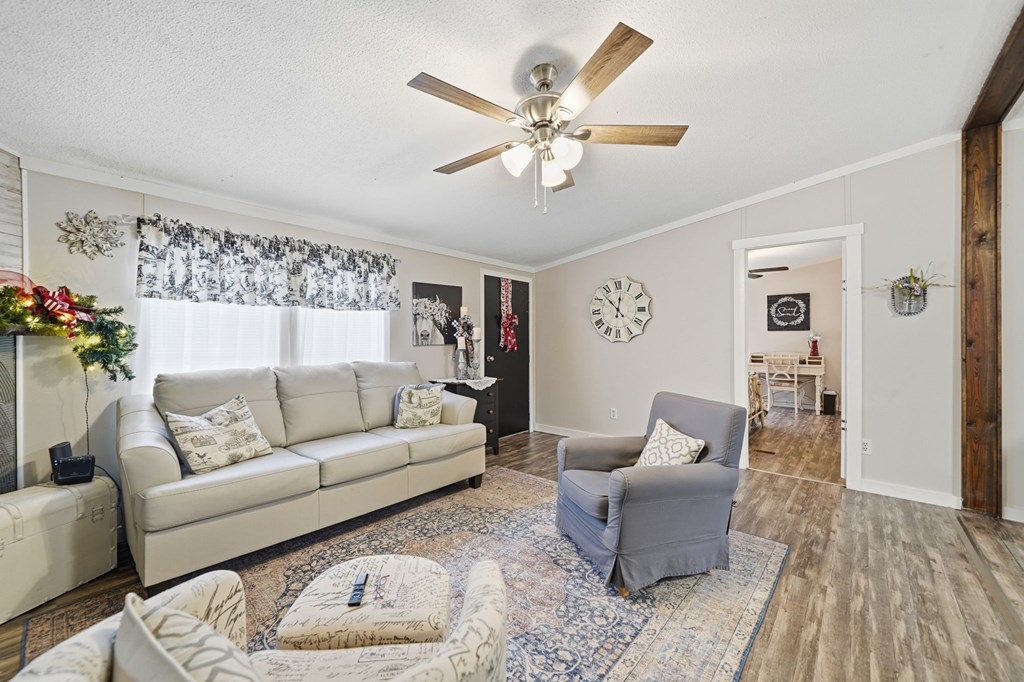 194 Burgess Road Ellijay, GA 30540 - Photo 5 of 32 a living room with furniture and a wooden floor