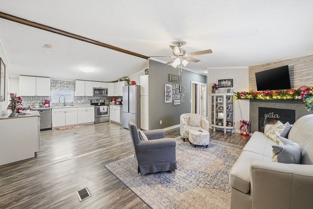 194 Burgess Road Ellijay, GA 30540 - Photo 6 of 32 a living room with furniture and a flat screen tv