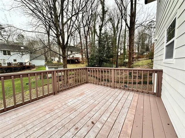 a deck with trees in front of it