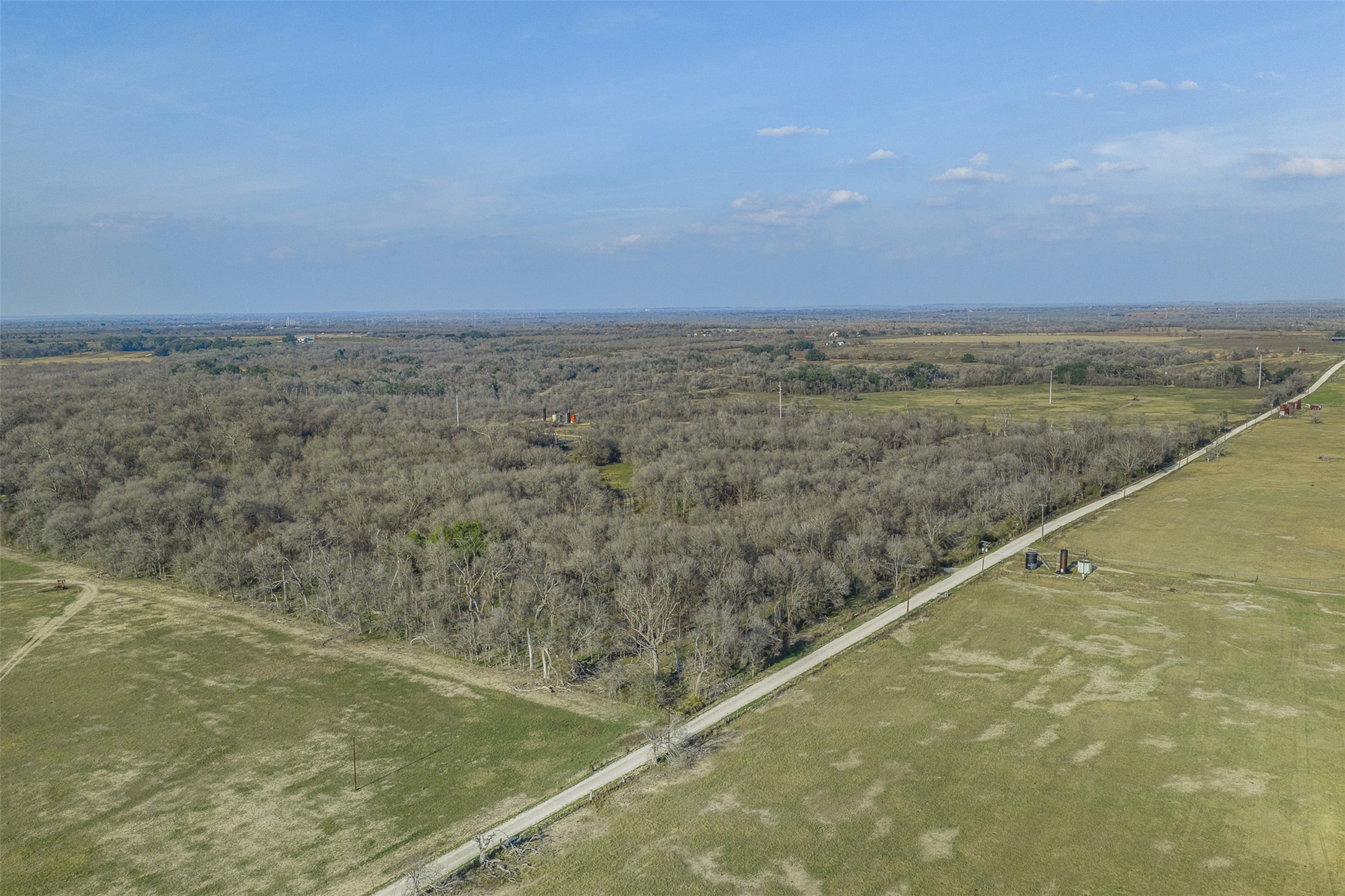 1144 Treetop Lane Luling, TX 78648 - Photo 27 of 31 View of property location with a heavily wooded area