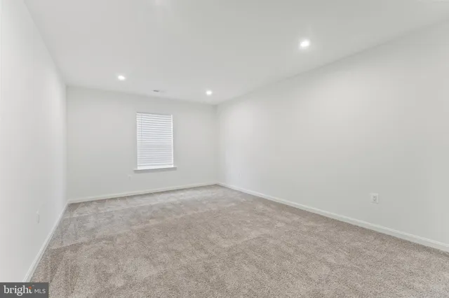 an empty room with a empty space and window