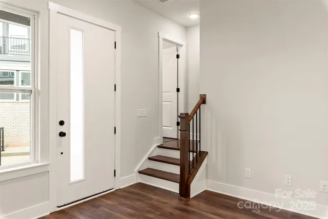 a view of entryway with wooden floor