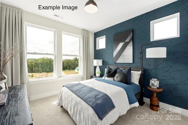 a bedroom with bed and window