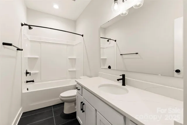 a bathroom with a sink a toilet and a bathtub