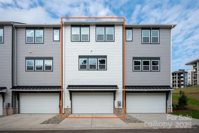 a view of a building with a window and garage