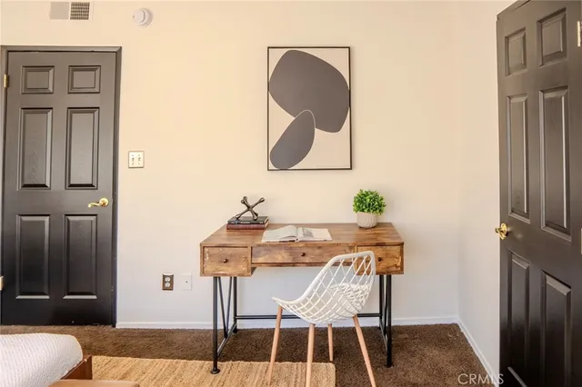 a view of a livingroom with furniture and wooden floor