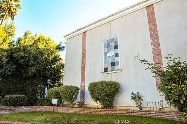 a view of house with garden space and swimming pool