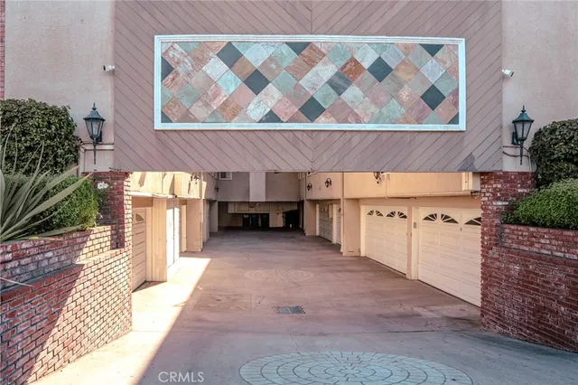 a view of a brick house with a outdoor space