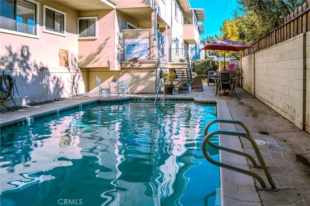 a view of swimming pool with a patio