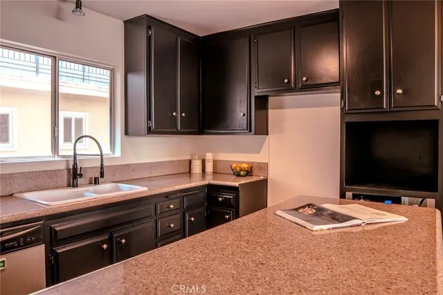 a kitchen with a sink and a stove
