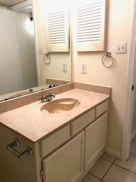 4748 Old Bent Tree Lane, Unit 803 Dallas, TX 75287 - Photo 15 of 18 a bathroom with a sink and a mirror