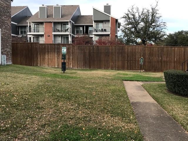 4748 Old Bent Tree Lane, Unit 803 Dallas, TX 75287 - Photo 18 of 18 a front view of a house with a yard