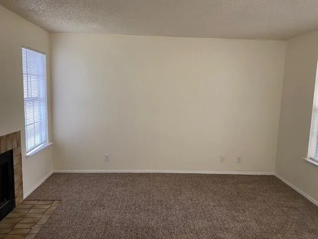 a view of an empty room and window