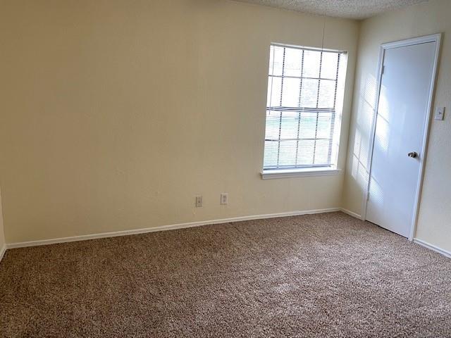 4748 Old Bent Tree Lane, Unit 803 Dallas, TX 75287 - Photo 6 of 18 an empty room with windows