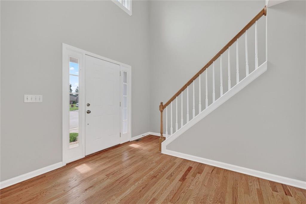 641 Olde Ivy Way Stone Mountain, GA 30087 - Photo 11 of 40 a view of an entryway with wooden floor