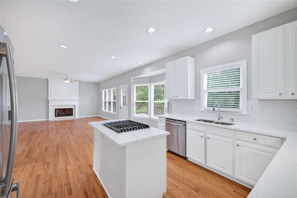 641 Olde Ivy Way Stone Mountain, GA 30087 - Photo 12 of 40 a kitchen that has a sink and a stove in it
