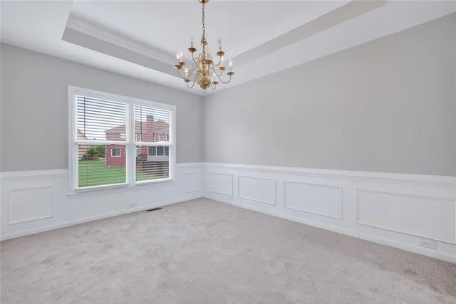 a view of an empty room and closet area