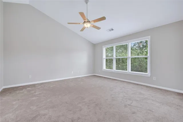 a spacious bathroom with a double vanity sink a large mirror and a bathtub