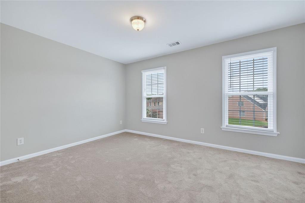 641 Olde Ivy Way Stone Mountain, GA 30087 - Photo 20 of 40 an empty room with windows