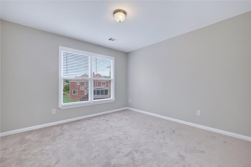 641 Olde Ivy Way Stone Mountain, GA 30087 - Photo 22 of 40 an empty room with a window
