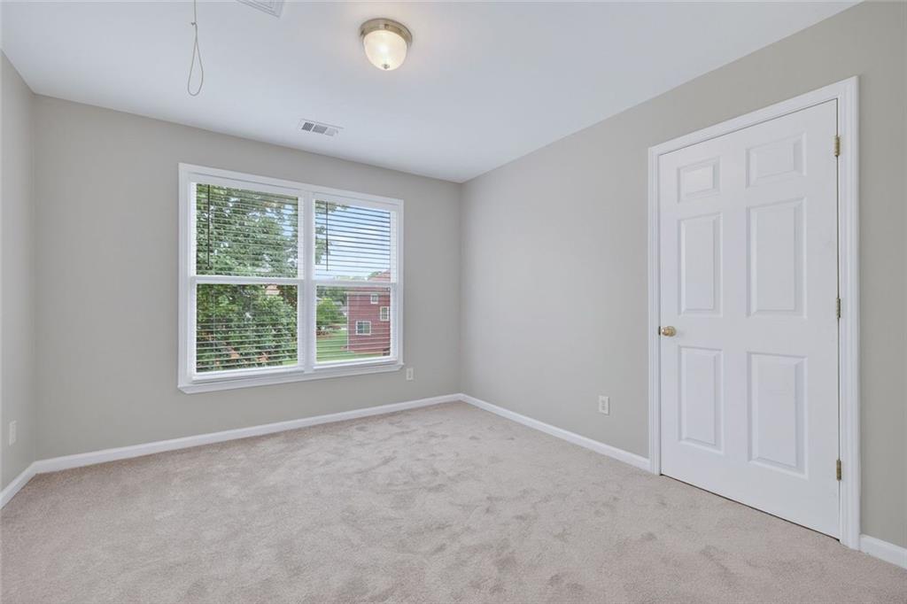 641 Olde Ivy Way Stone Mountain, GA 30087 - Photo 23 of 40 an empty room with a window