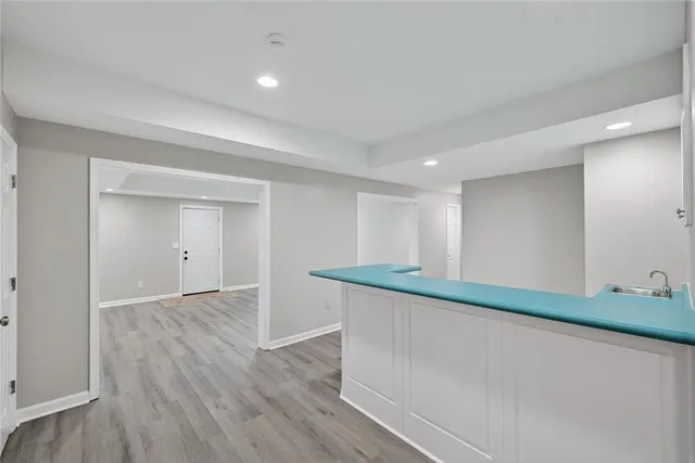 a view of kitchen with wooden floor
