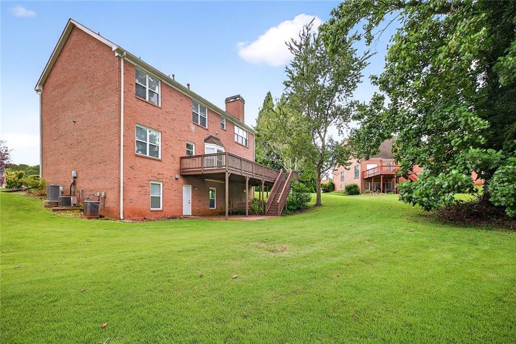 641 Olde Ivy Way Stone Mountain, GA 30087 - Photo 30 of 40 a view of a house with a yard