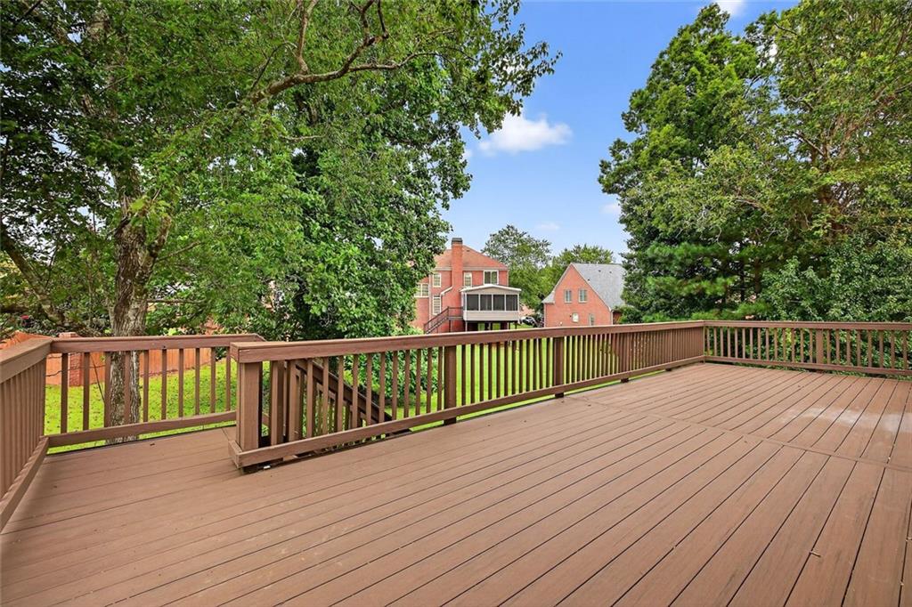 641 Olde Ivy Way Stone Mountain, GA 30087 - Photo 31 of 40 a view of balcony with wooden floor and fence