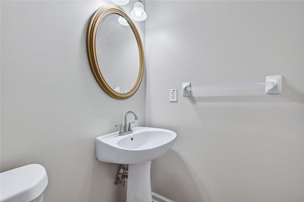 641 Olde Ivy Way Stone Mountain, GA 30087 - Photo 33 of 40 a bathroom with a sink and a mirror