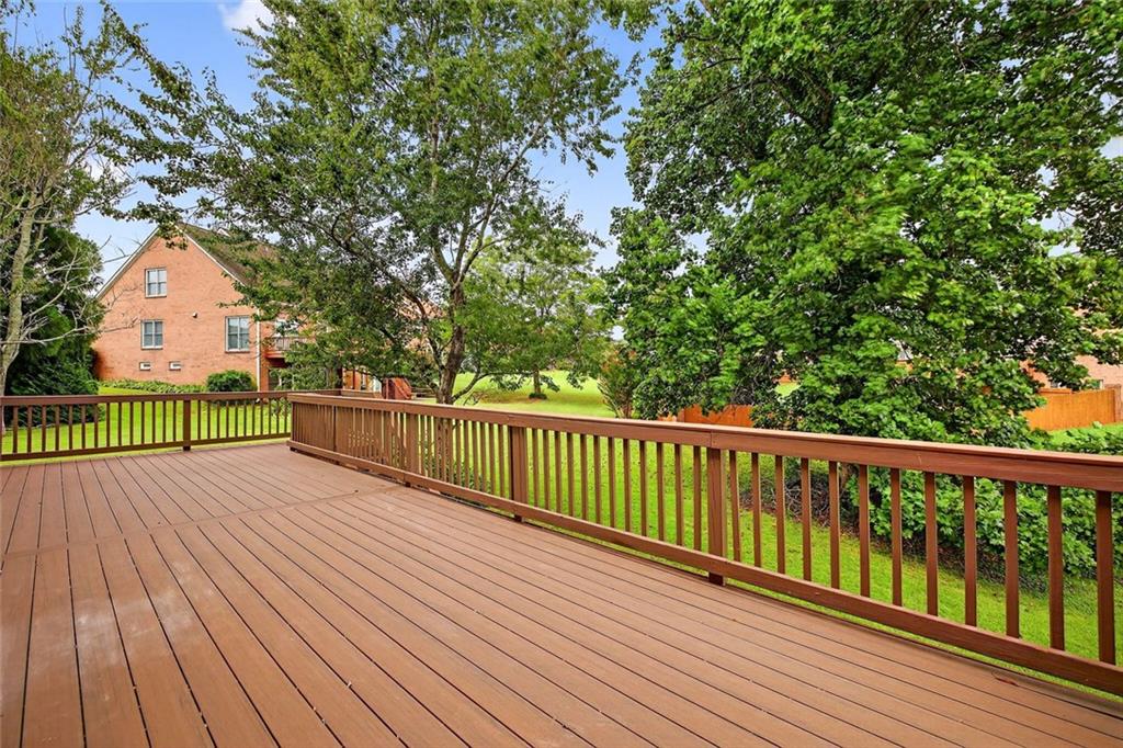 641 Olde Ivy Way Stone Mountain, GA 30087 - Photo 34 of 40 a view of balcony with wooden floor and fence