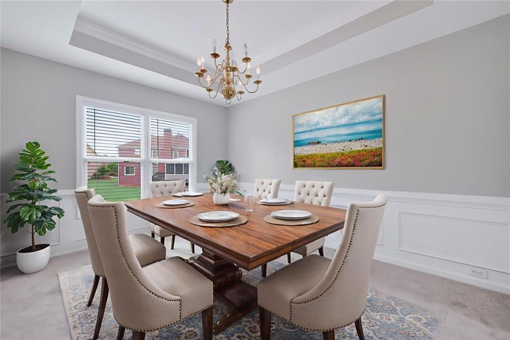 641 Olde Ivy Way Stone Mountain, GA 30087 - Photo 4 of 40 a view of a dining room with furniture window and wooden floor
