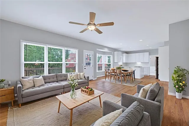 a living room with furniture and a large window