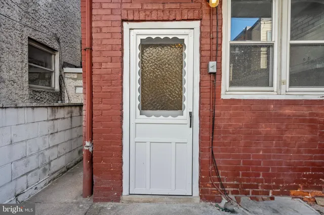 a view of front door of a house with a window