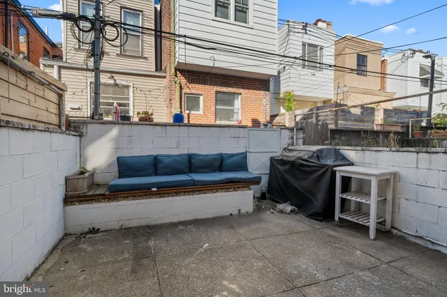 a view of a terrace with sitting area
