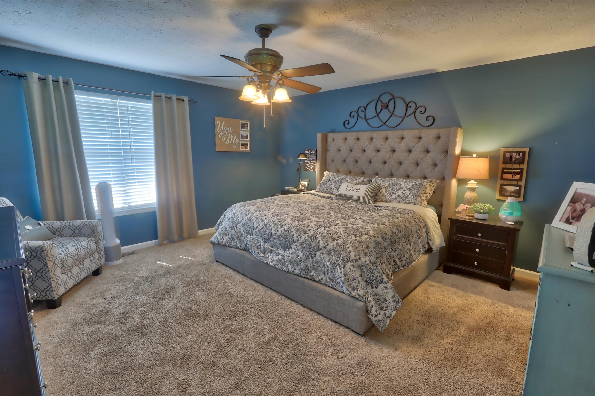 3368 Maxie Jones Road Springfield, TN 37172 - Photo 12 of 27 a bedroom with a bed and a chandelier